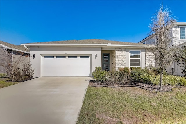 view of front of house with a garage and a front lawn