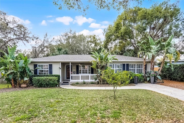 single story home with a front yard and covered porch