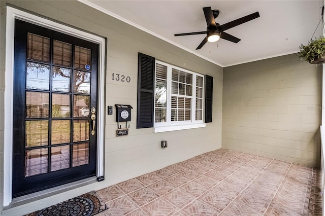 entrance to property with ceiling fan