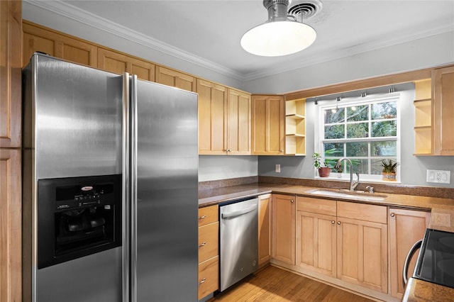 kitchen featuring stainless steel appliances, crown molding, sink, and light brown cabinetry