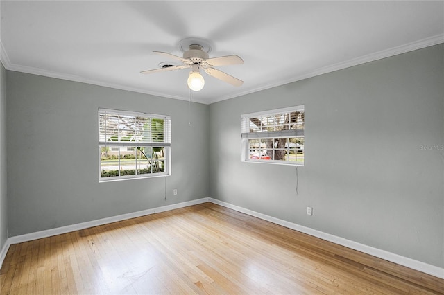 unfurnished room featuring crown molding, wood-type flooring, and ceiling fan