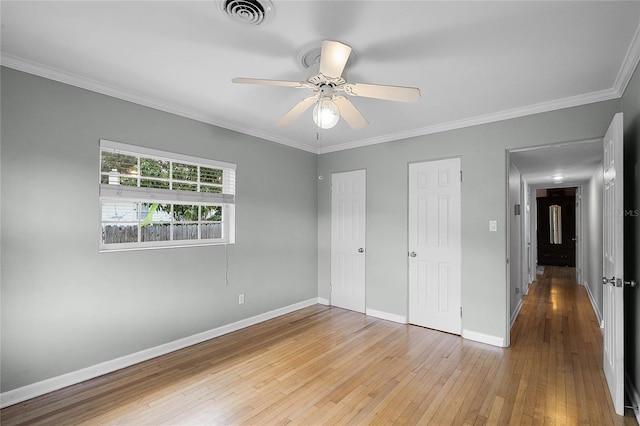 unfurnished bedroom featuring crown molding, light hardwood / wood-style floors, and ceiling fan