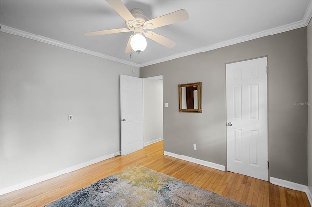 bedroom featuring crown molding, ceiling fan, and hardwood / wood-style floors