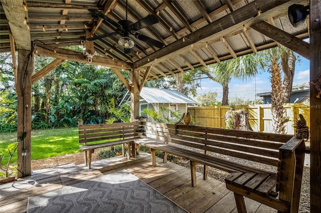 view of patio / terrace featuring ceiling fan and a deck