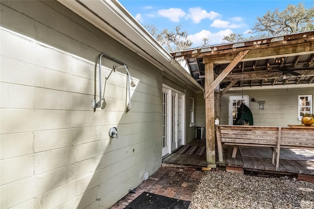 view of side of home featuring a wooden deck