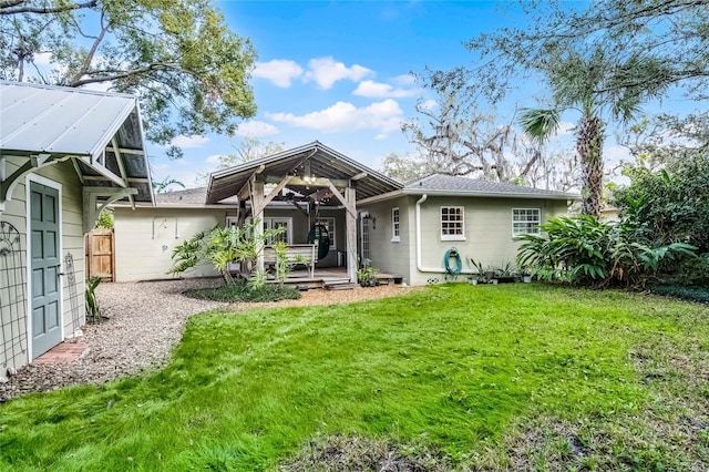 rear view of house with a lawn