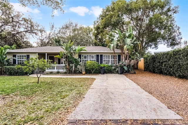 ranch-style house with a front lawn