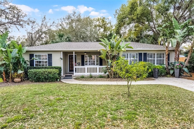 ranch-style home with a porch and a front lawn