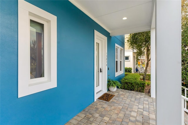 doorway to property with stucco siding