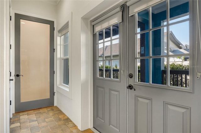 entryway featuring stone finish floor