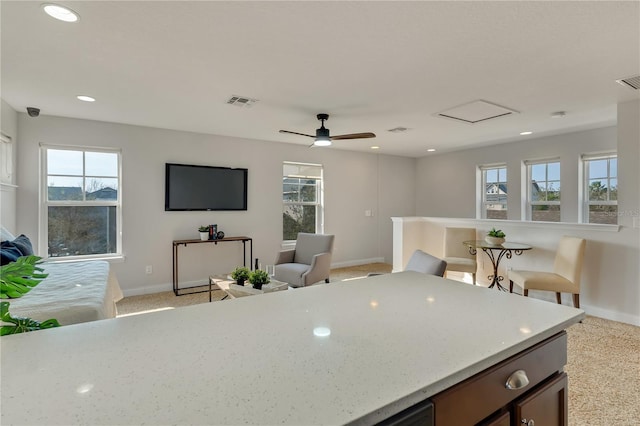 kitchen featuring recessed lighting, open floor plan, visible vents, and baseboards