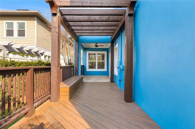 wooden deck featuring a pergola