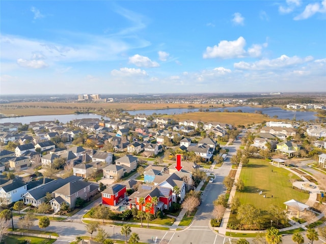 bird's eye view featuring a residential view and a water view