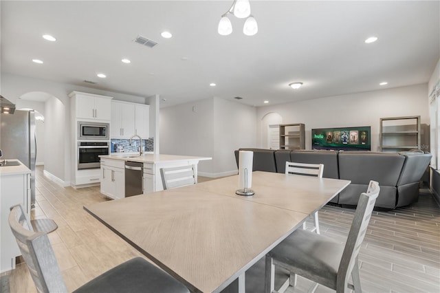 dining room featuring sink