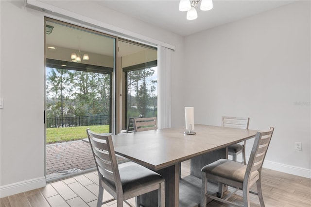 dining space with light hardwood / wood-style flooring