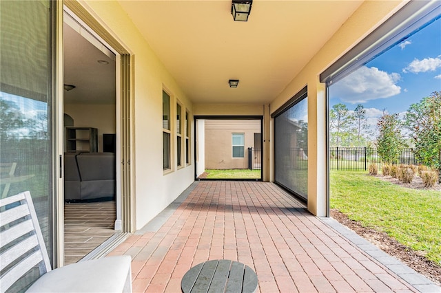 wooden terrace with a patio area