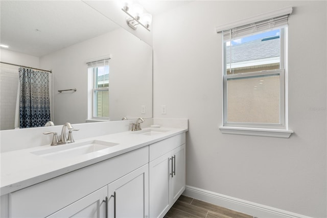 bathroom with vanity and curtained shower