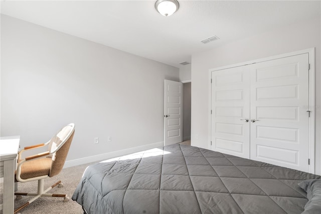 carpeted bedroom featuring a closet