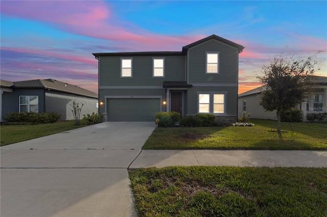 traditional home featuring an attached garage, a front lawn, and concrete driveway