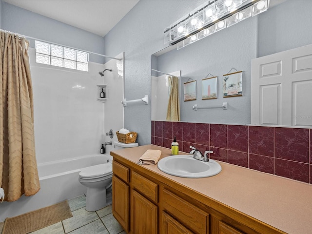 full bathroom with vanity, shower / bath combo, toilet, tile patterned floors, and tasteful backsplash