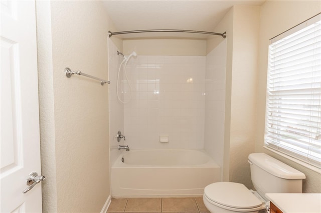 full bathroom with vanity, tiled shower / bath, tile patterned floors, and toilet