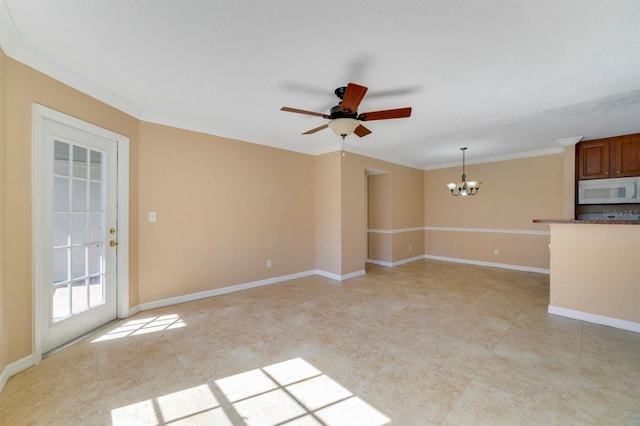 unfurnished living room featuring ceiling fan with notable chandelier and ornamental molding