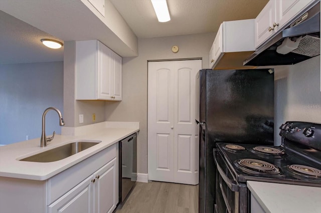 kitchen featuring sink, black appliances, a textured ceiling, white cabinets, and light wood-type flooring