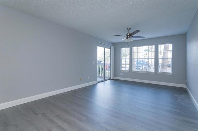 unfurnished room featuring ceiling fan, a textured ceiling, and dark hardwood / wood-style flooring