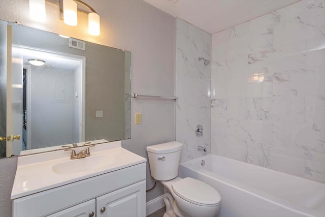 full bathroom with tiled shower / bath combo, vanity, and toilet