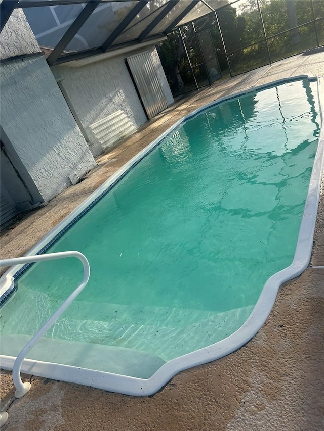 view of pool with a lanai