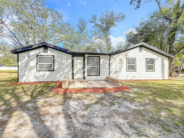 single story home with a patio and a front yard