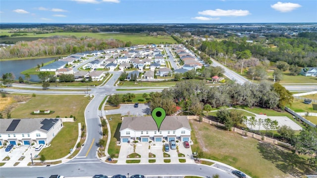 bird's eye view with a water view and a residential view