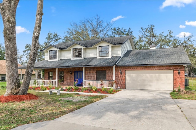 view of front of home with an attached garage, covered porch, and brick siding