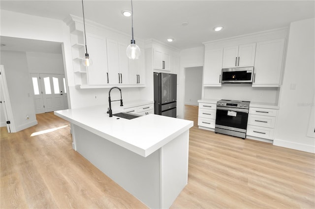 kitchen with open shelves, hanging light fixtures, appliances with stainless steel finishes, a sink, and a peninsula