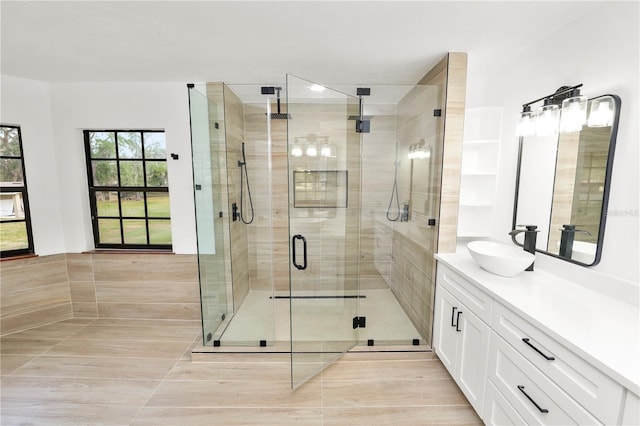 full bath featuring a shower stall and vanity