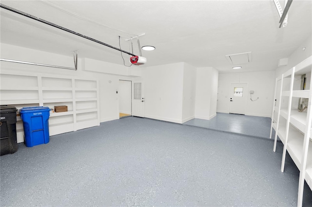 garage featuring baseboards and a garage door opener