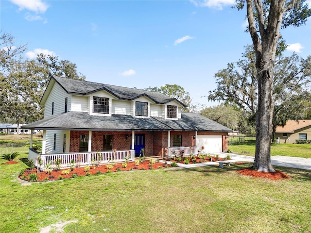 farmhouse inspired home with a garage, driveway, a porch, and a front yard