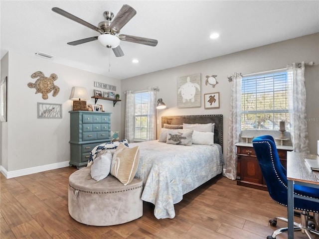 bedroom with hardwood / wood-style floors and ceiling fan