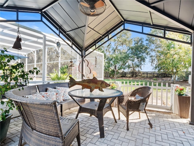 sunroom / solarium with vaulted ceiling