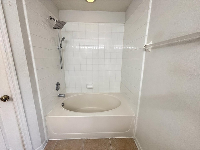 bathroom featuring tile patterned floors and tiled shower / bath combo