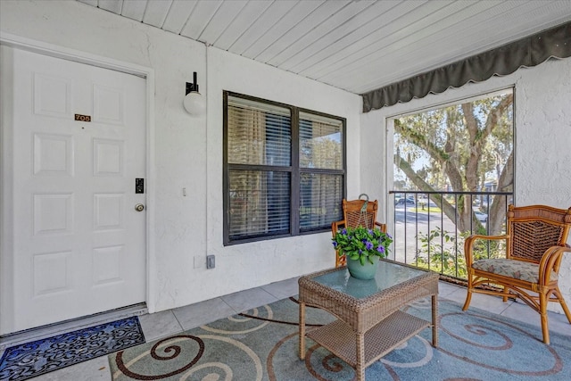 entrance to property featuring a porch