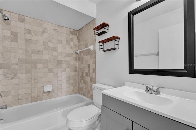 bathroom with bathtub / shower combination, vanity, and toilet