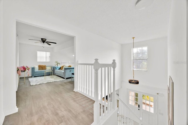 5108 Avignon Ct, Orlando, FL 32839 - hall featuring an upstairs landing and wood finished floors