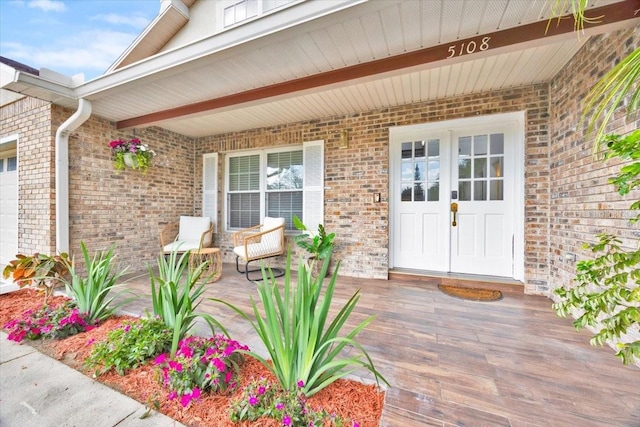 5108 Avignon Ct, Orlando, FL 32839 - doorway to property with brick siding and a porch