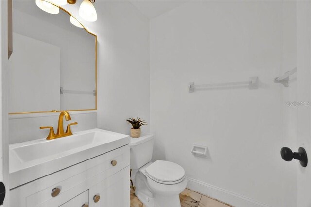 5108 Avignon Ct, Orlando, FL 32839 - bathroom featuring vanity, toilet, and baseboards
