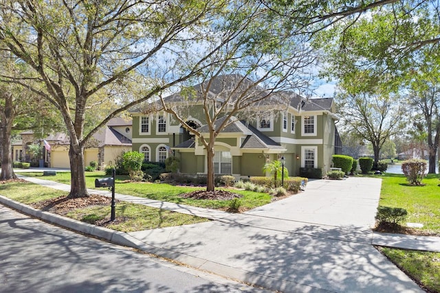 front facade with a front yard