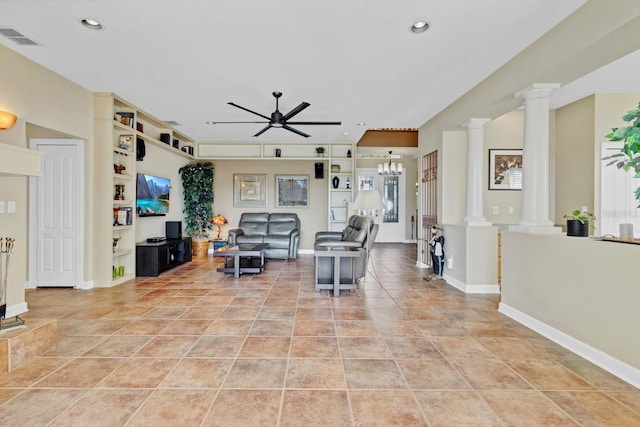 living room with light tile patterned floors, decorative columns, and ceiling fan