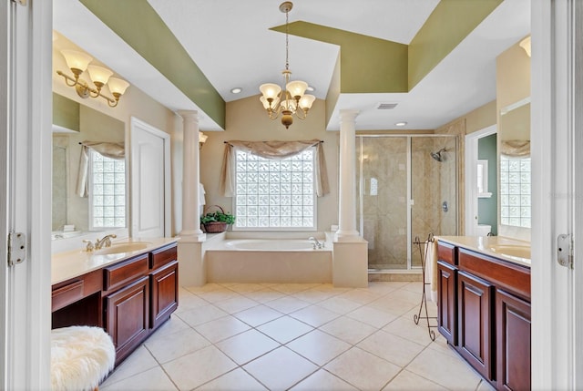 bathroom with decorative columns, shower with separate bathtub, tile patterned flooring, and vanity