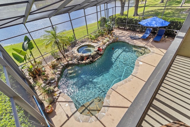 view of pool featuring a lanai, a patio area, and an in ground hot tub