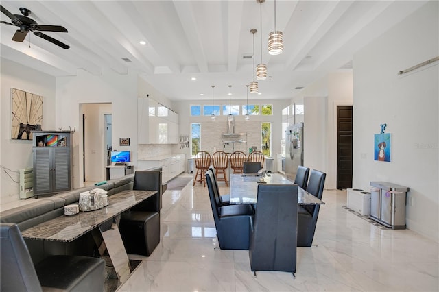 dining space with recessed lighting, a ceiling fan, baseboards, marble finish floor, and beam ceiling